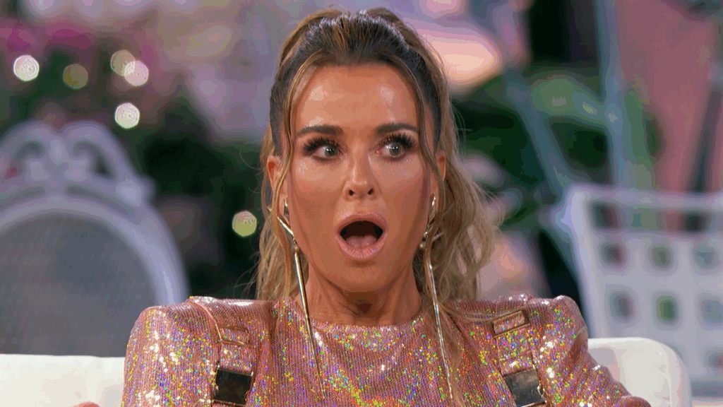 Kyle Richards reacts, her mouth agape.