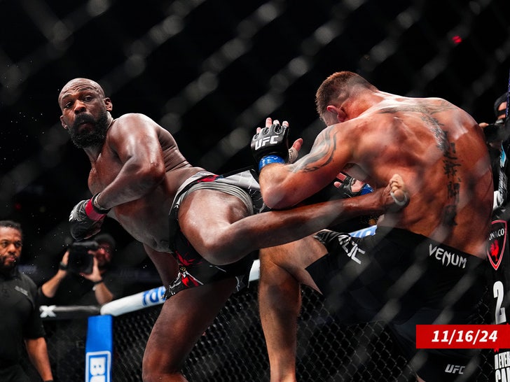 Jon Jones landing a kick during his UFC heavyweight title defense