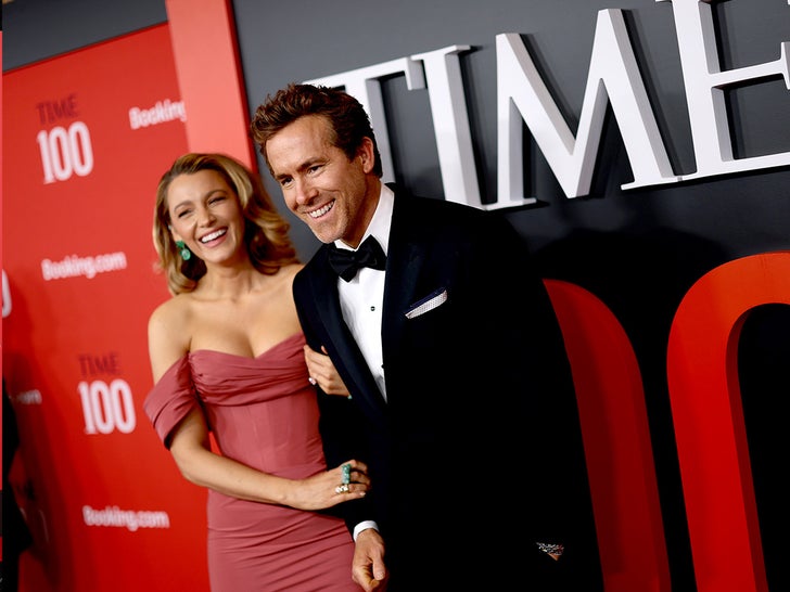 Blake Lively and Ryan Reynolds posing at TIME100 Gala