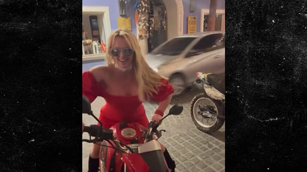 Britney Spears Hops on Back of Motorcycle in Bright Red Dress