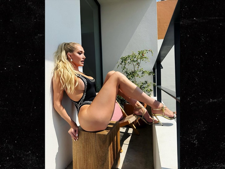 Erika Jayne Swimsuit Photos: RHOBH Star Dazzles Fans in Rhinestone-Embellished Beach Look Erika Jayne swimsuit photos balcony pose