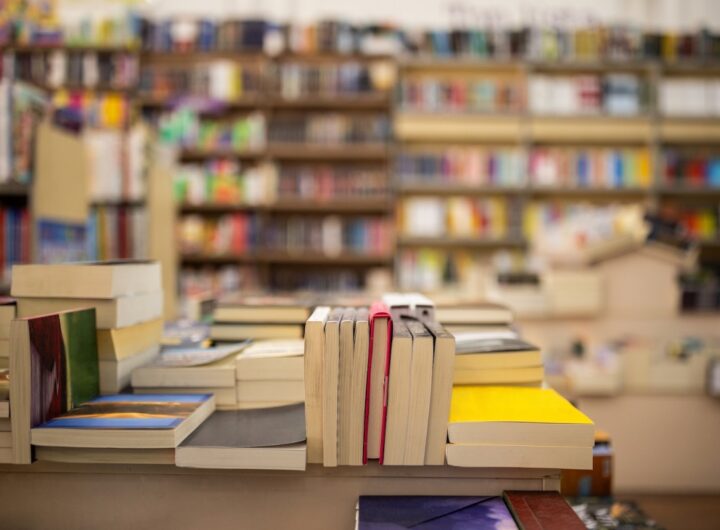Interior of a modern bookstore with variety of books stacked all around.