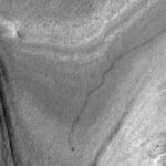 NASA’s Mars orbiter snapped this image of Curiosity trucking along down at the surface