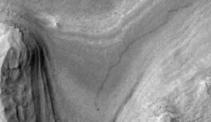 NASA’s Mars orbiter snapped this image of Curiosity trucking along down at the surface