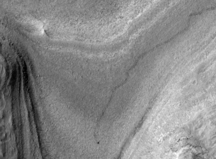 NASA’s Mars orbiter snapped this image of Curiosity trucking along down at the surface