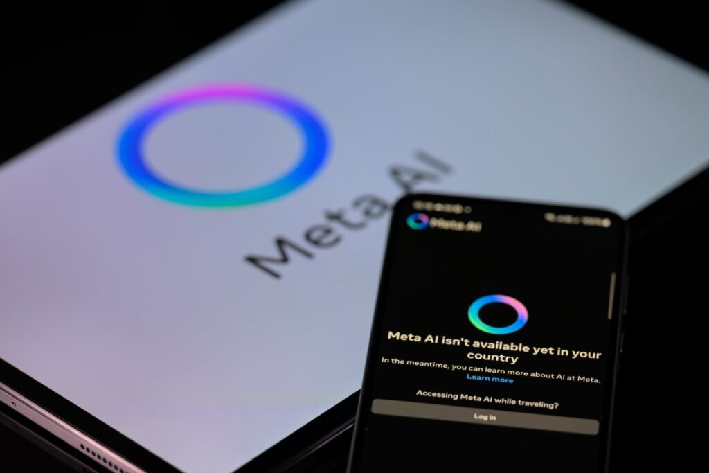 Meta's Celebrity-Voiced Chatbots Investigation Reveals Explicit Conversations with Minors The Meta AI app is displayed on a mobile phone with the Meta AI logo visible on a tablet in this photo illustration