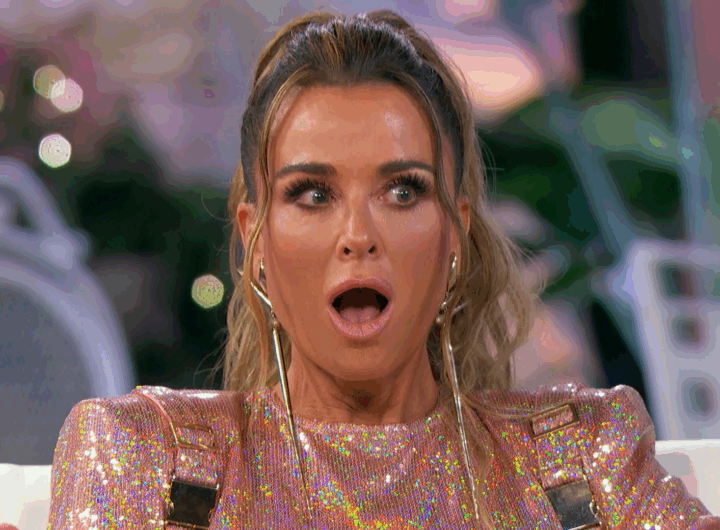 Kyle Richards reacts, her mouth agape.