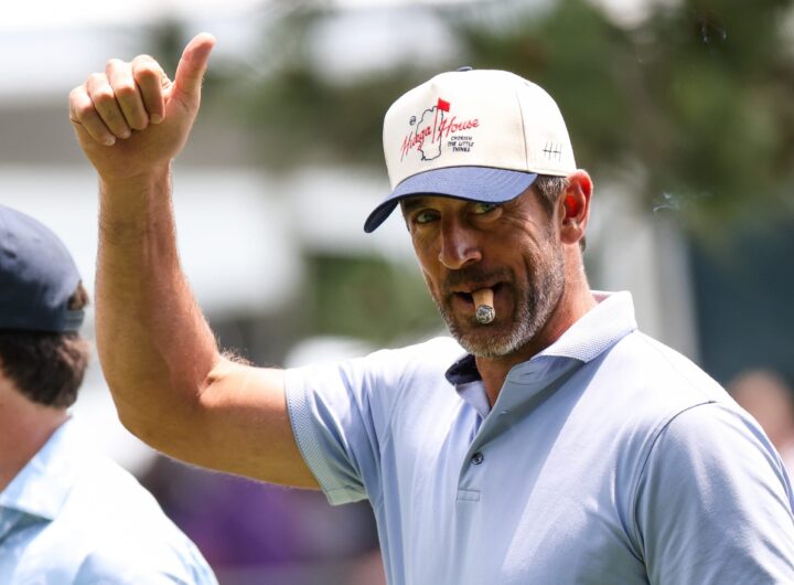 NFL football player Aaron Rodgers gives a thumbs up to the crowd at the 15th hole on day one of the 2024 American Century Championship at Edgewood Tahoe Golf Course on July 12, 2024 in Stateline, Nevada.