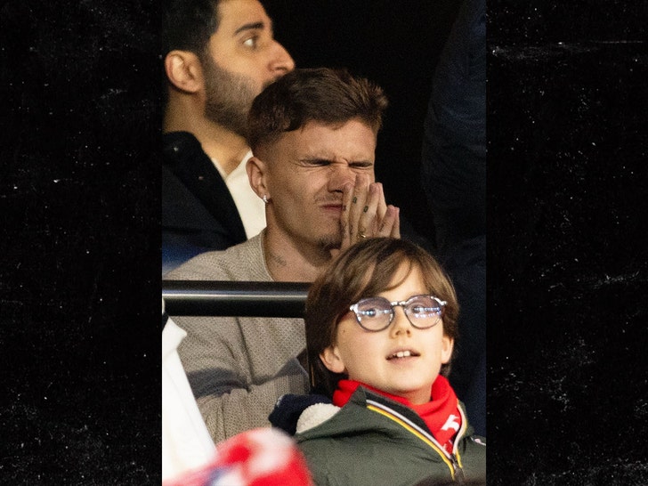 Beckham Family Feud 2025: Romeo Beckham Appears Tense at Paris Soccer Match Amid Escalating Brother Conflict Romeo Beckham watching soccer match in Paris