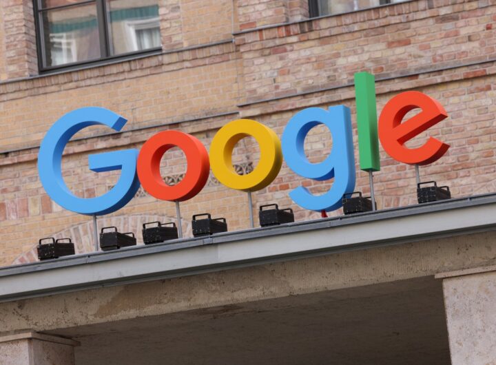 Google corporate logo hangs outside the Google Germany offices