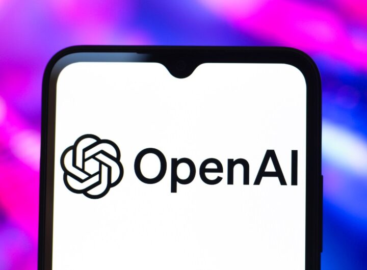 The OpenAI logo is seen displayed on a smartphone screen.