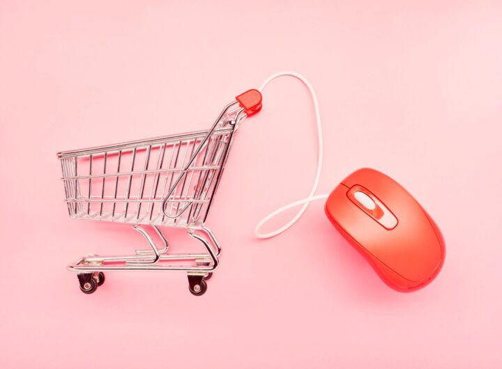 small shopping cart and red computer mouse